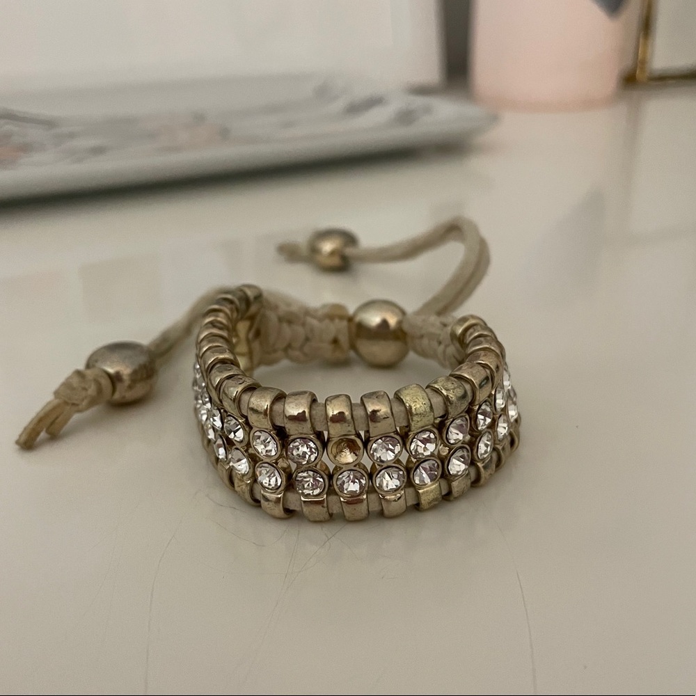 Gold and rhinestone draw bracelet